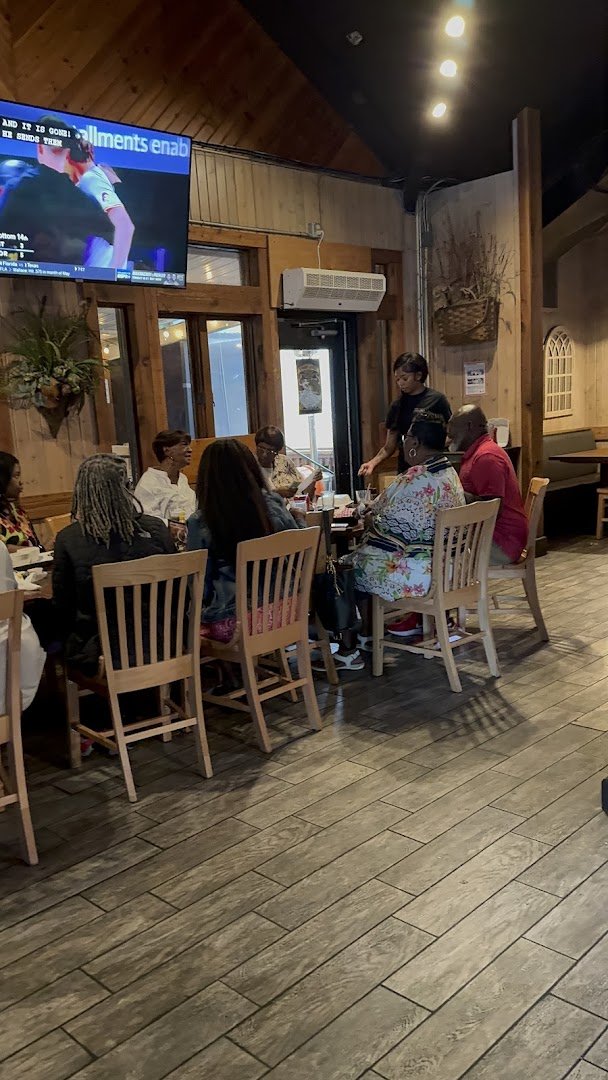 Outdoor tables beside a casual Southern seafood restaurant.