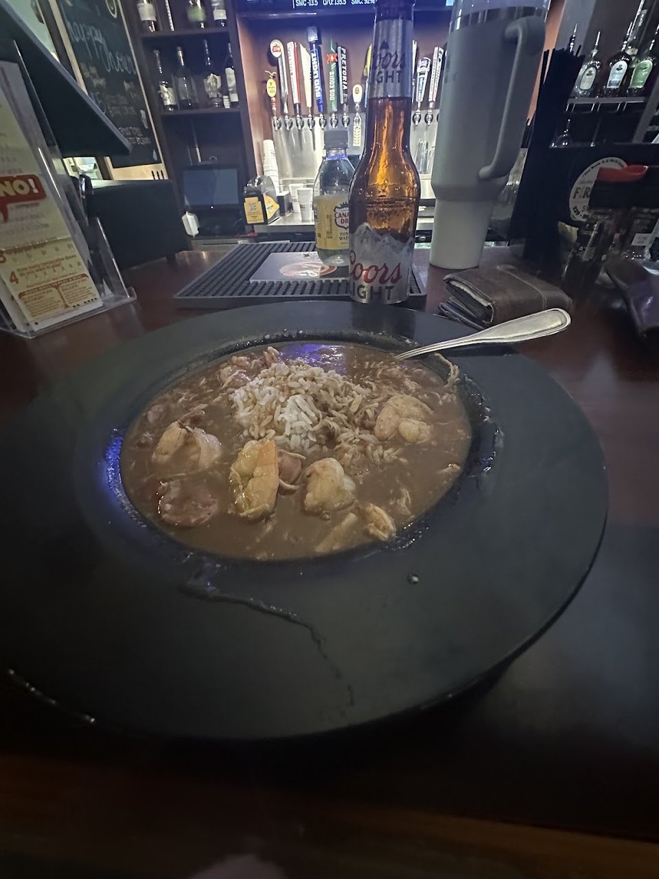 Seafood-focused menu with wings, tacos, and soups.