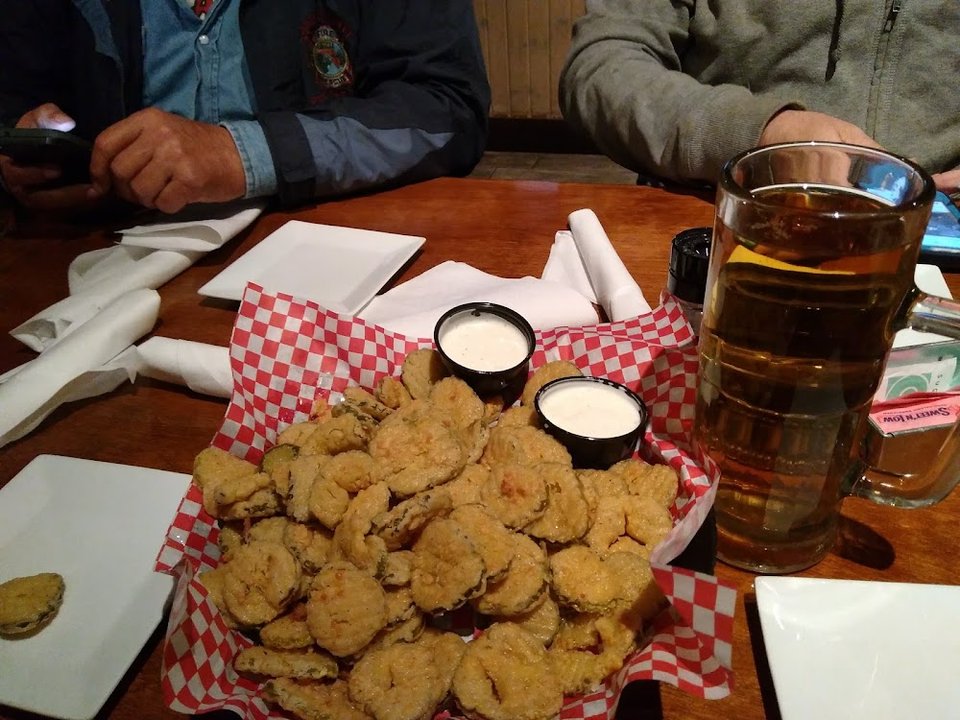 Seafood-focused menu with wings, tacos, and soups.