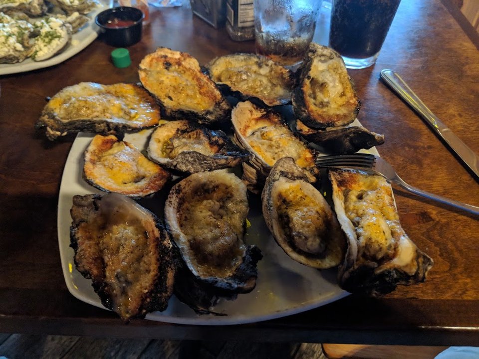 Seafood-focused menu with wings, tacos, and soups.